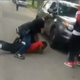 A plainclothes police officer is seen straddling Jermaine Milan in Chicago. (NBC Chicago)